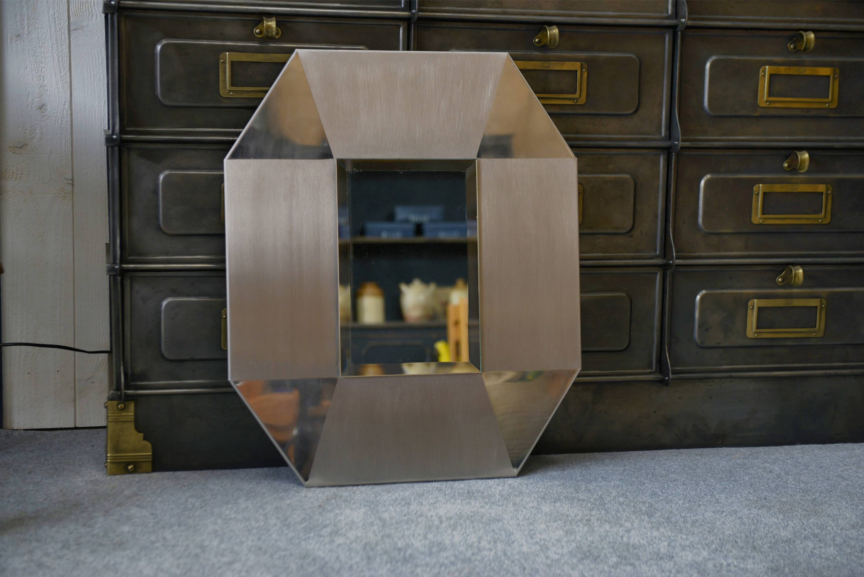 Designer mirror in brushed and chrome-plated stainless steel, beveled glass, 1970s