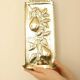 Vintage European brass sconce in pear motif
