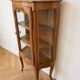 Small silver display cabinet in Louis XV style made of wood.