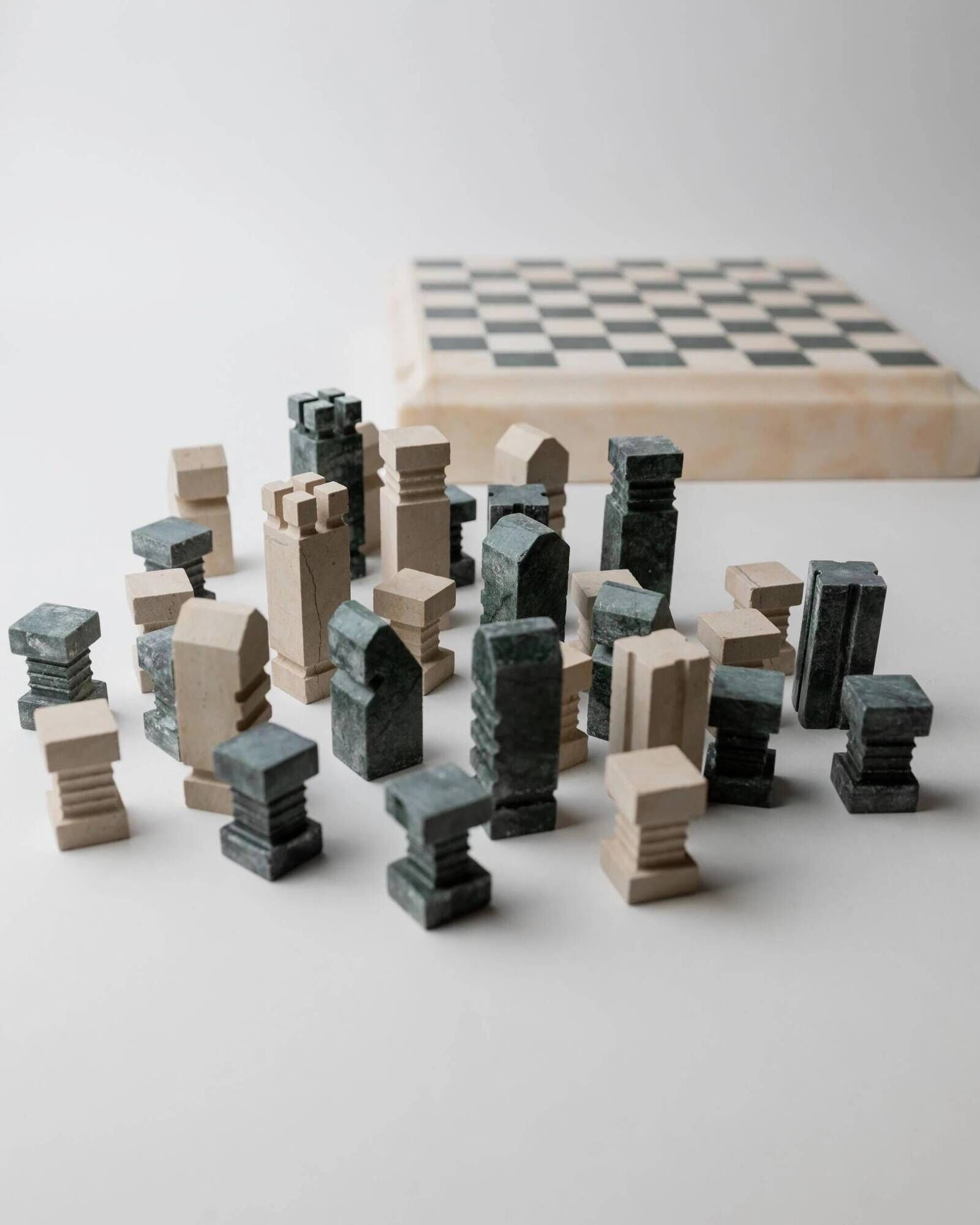 Vintage marble chess set from the 1970s, green and beige stone board, heavy design, geometric pieces, sculptural tabletop game, gift idea.