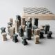 Vintage marble chess set from the 1970s, green and beige stone board, heavy design, geometric pieces, sculptural tabletop game, gift idea.