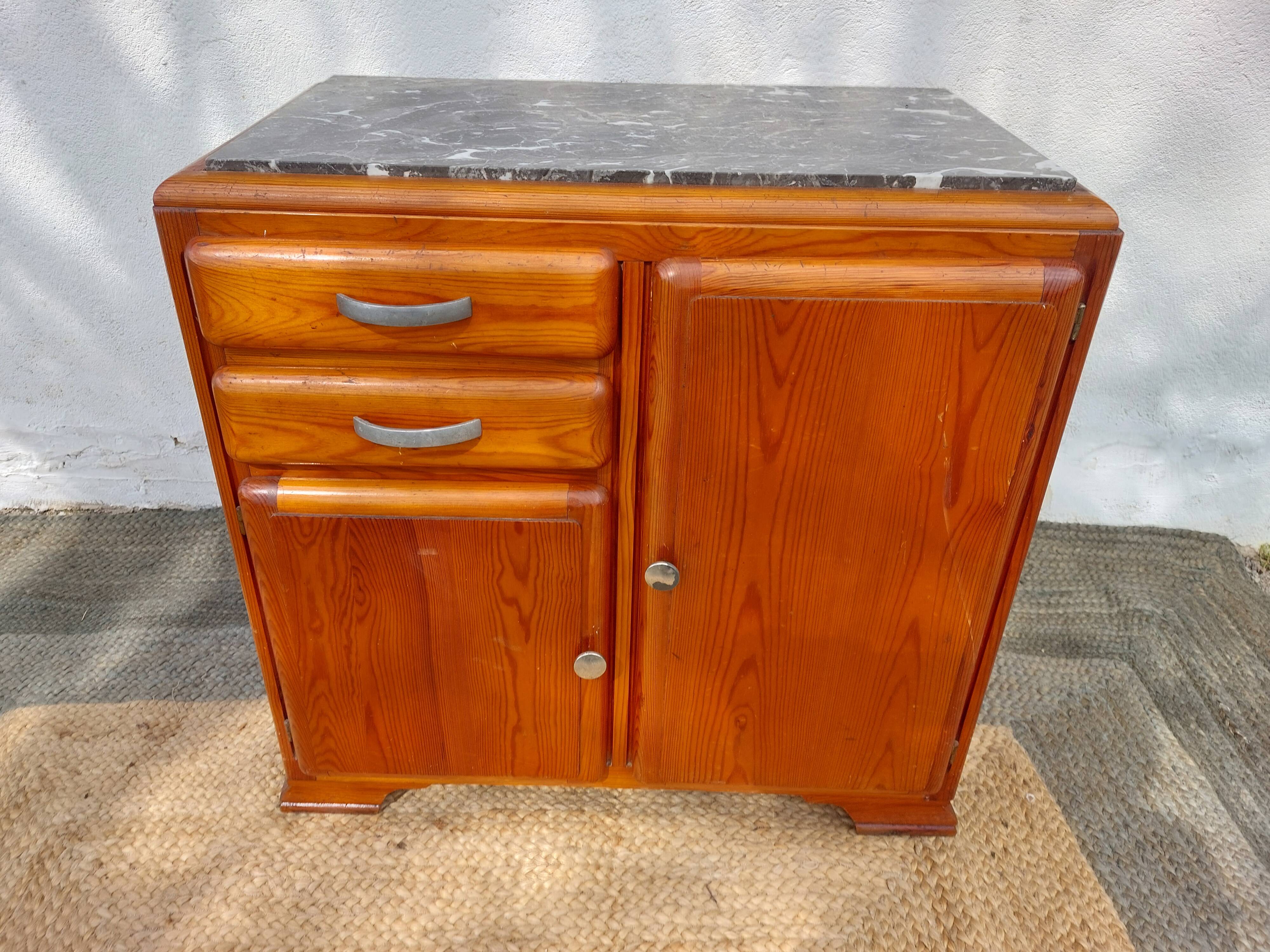 Mado buffet, marble top and asymmetrical doors.
