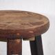 Antique round dark colored stool (c.1900)