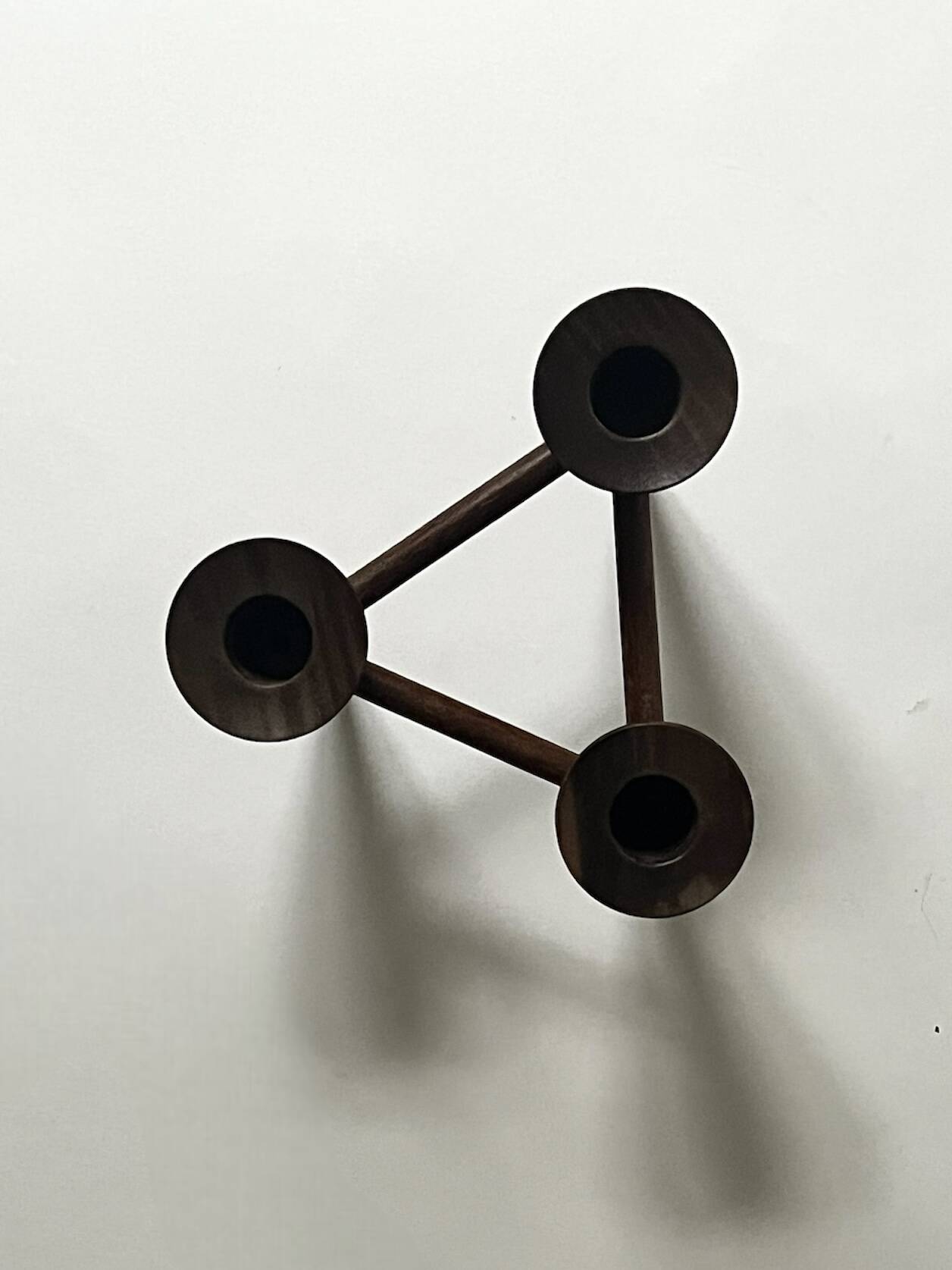 Scandinavian tripod candle holder in carved wood, design from around 1970.