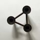 Scandinavian tripod candle holder in carved wood, design from around 1970.