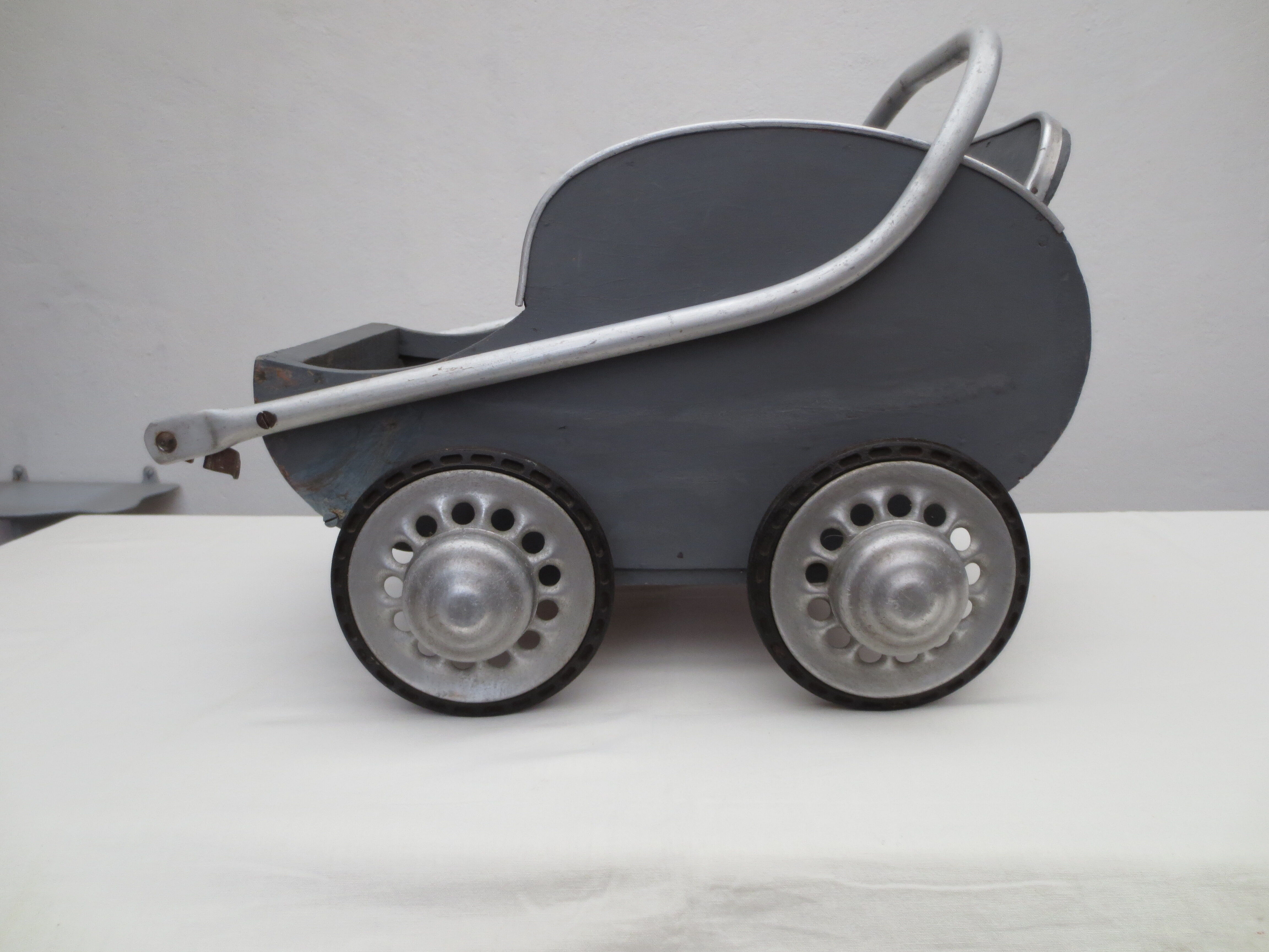 40 year old doll stroller, wood and aluminum