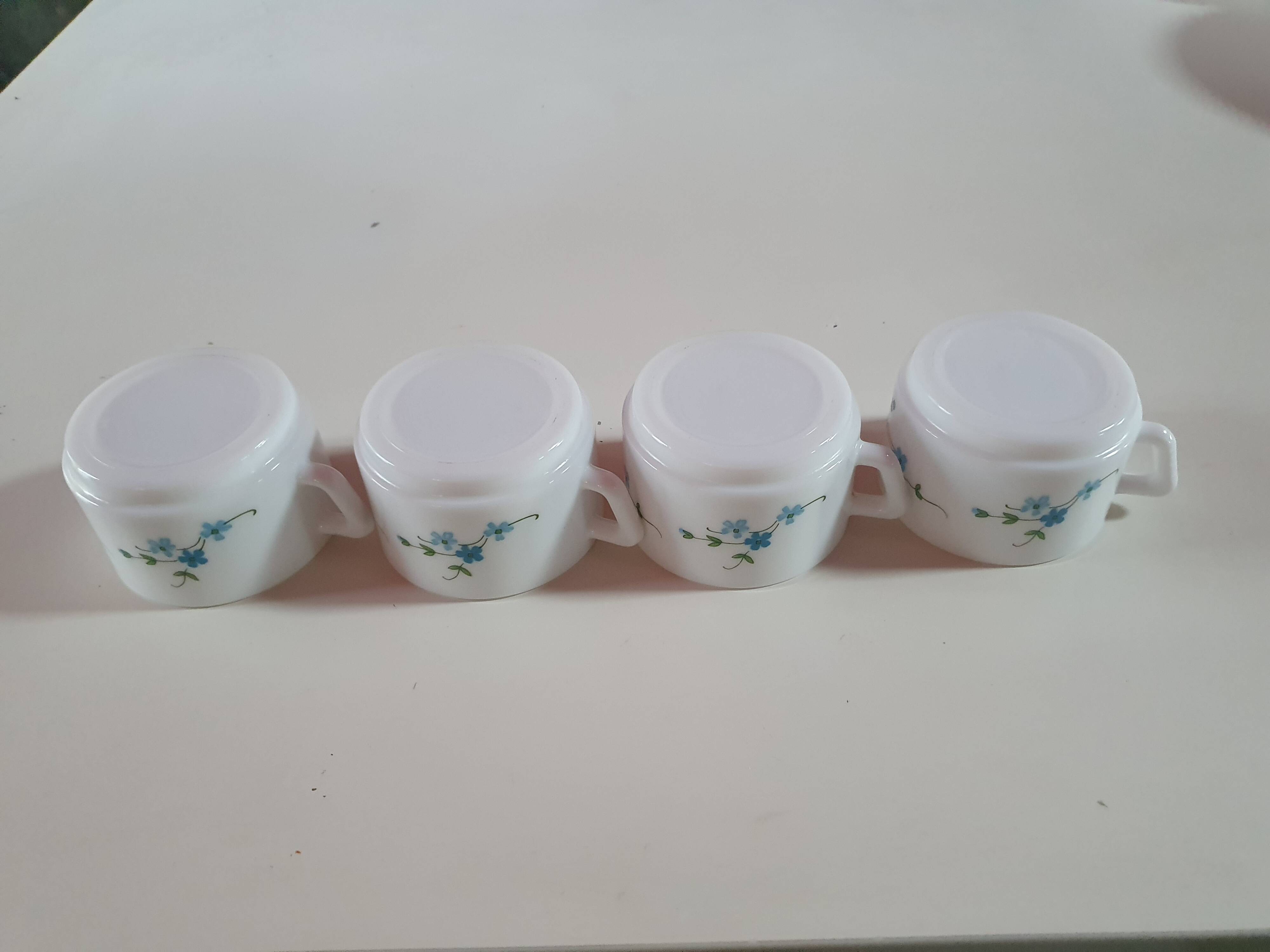 set of 4 vintage arcopal cups with small mysotis blue flowers