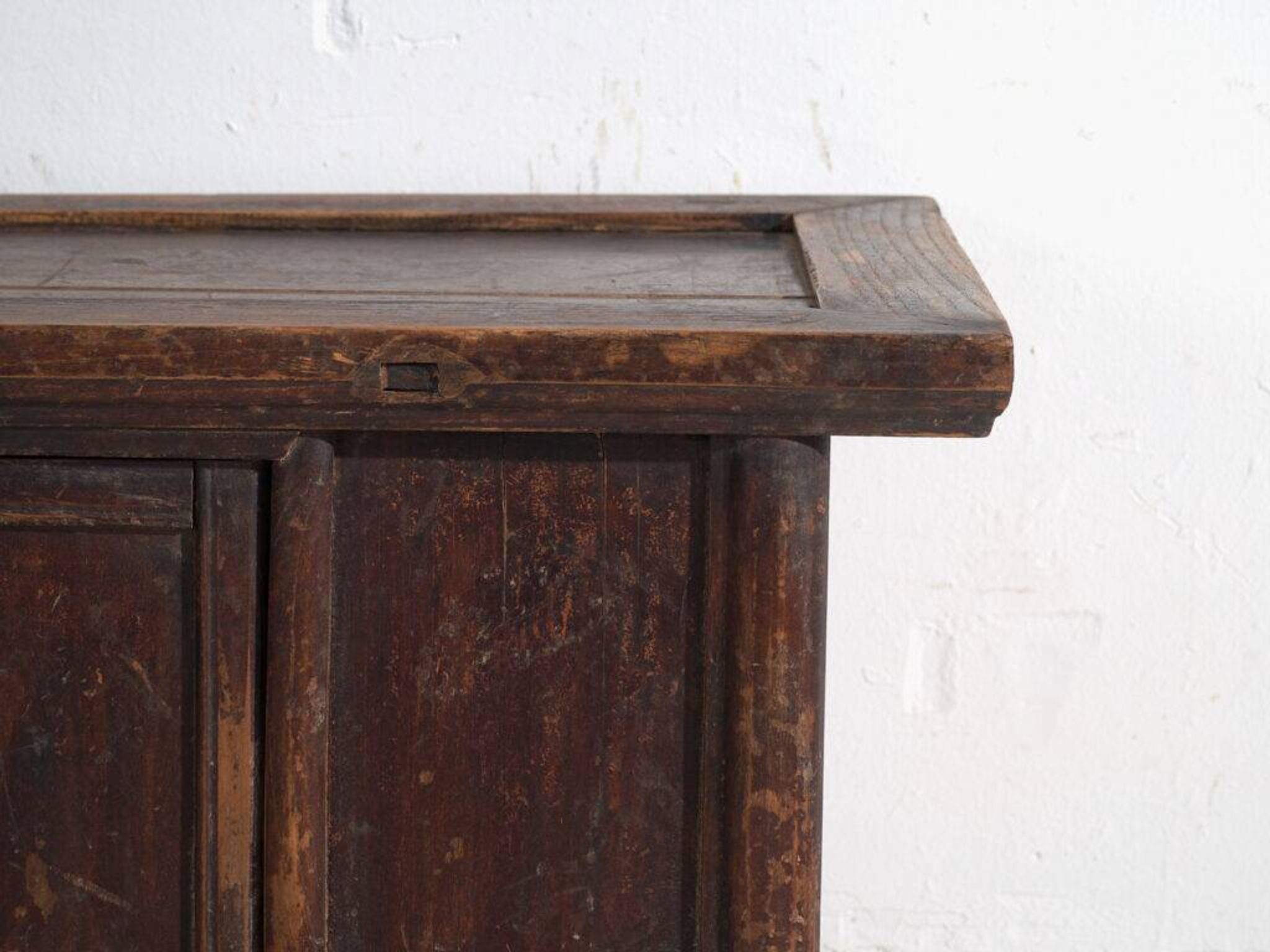 Chinese low altar cabinet with two doors and dark patina – China, around 1900