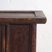 Chinese low altar cabinet with two doors and dark patina – China, around 1900