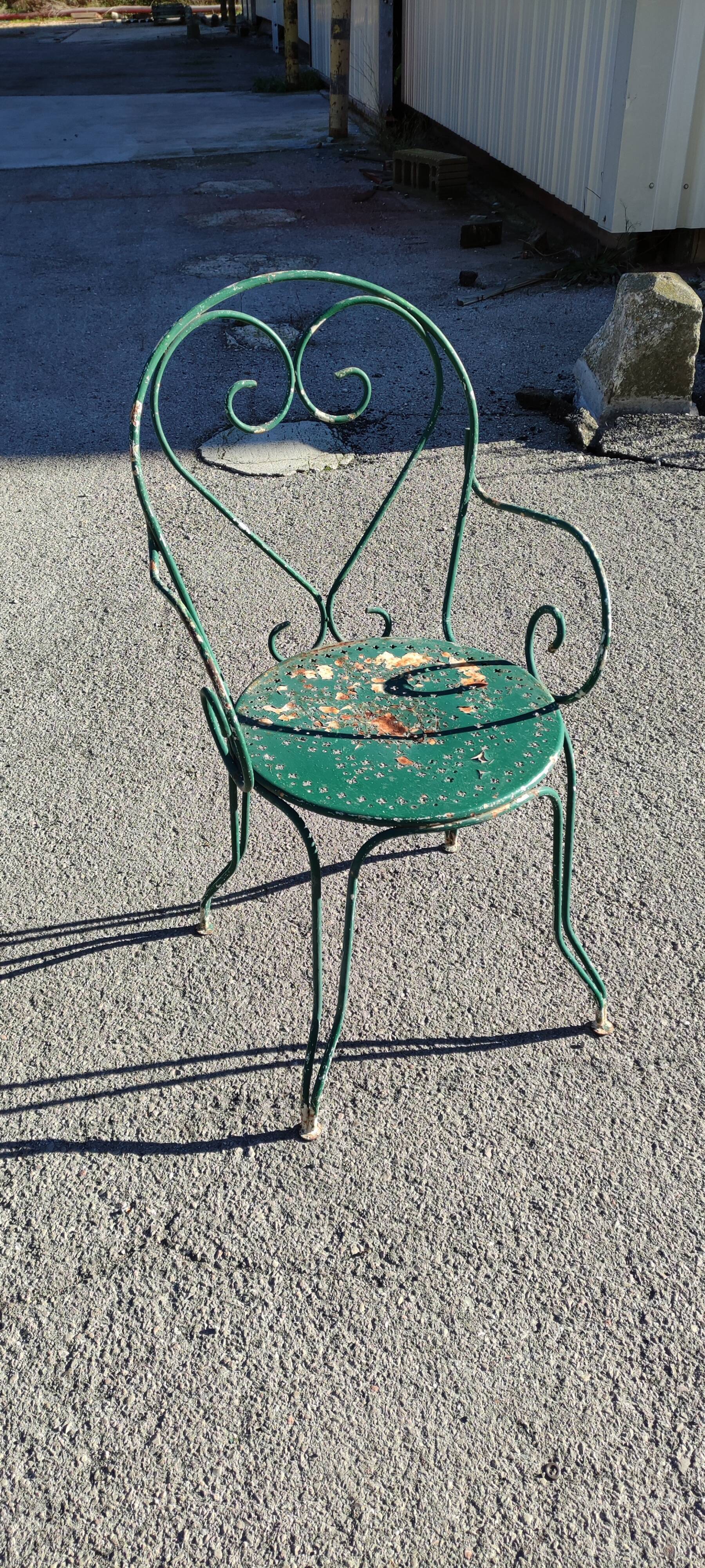Garden table, two armchairs and a metal chair
