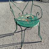 Garden table, two armchairs and a metal chair