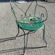 Garden table, two armchairs and a metal chair