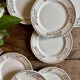Set of 8 vintage white and gold dessert plates.