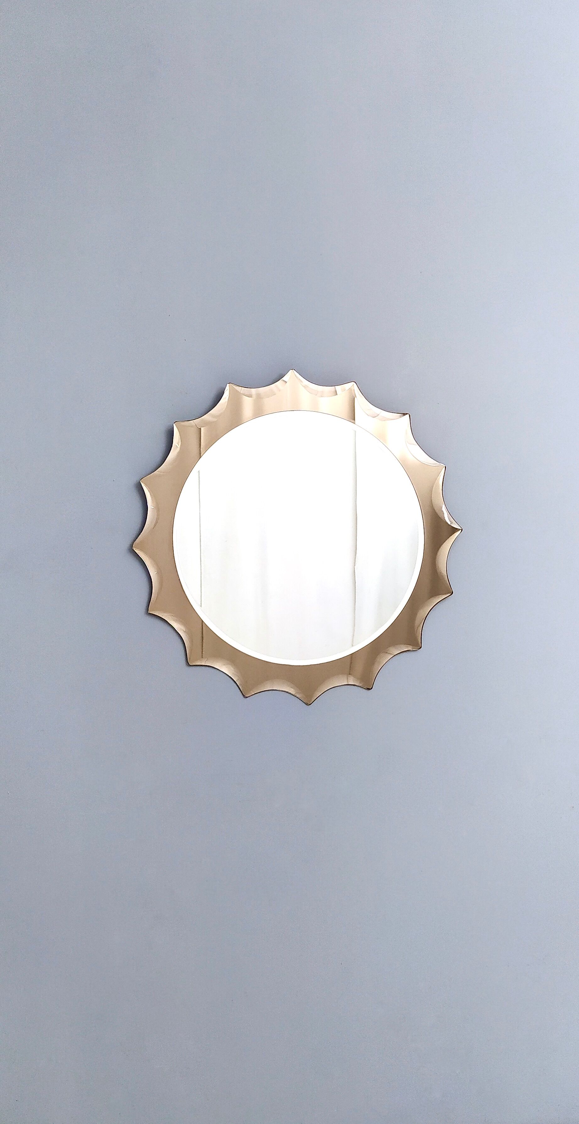 Postmodern sun shaped bronze wall mirror, italy