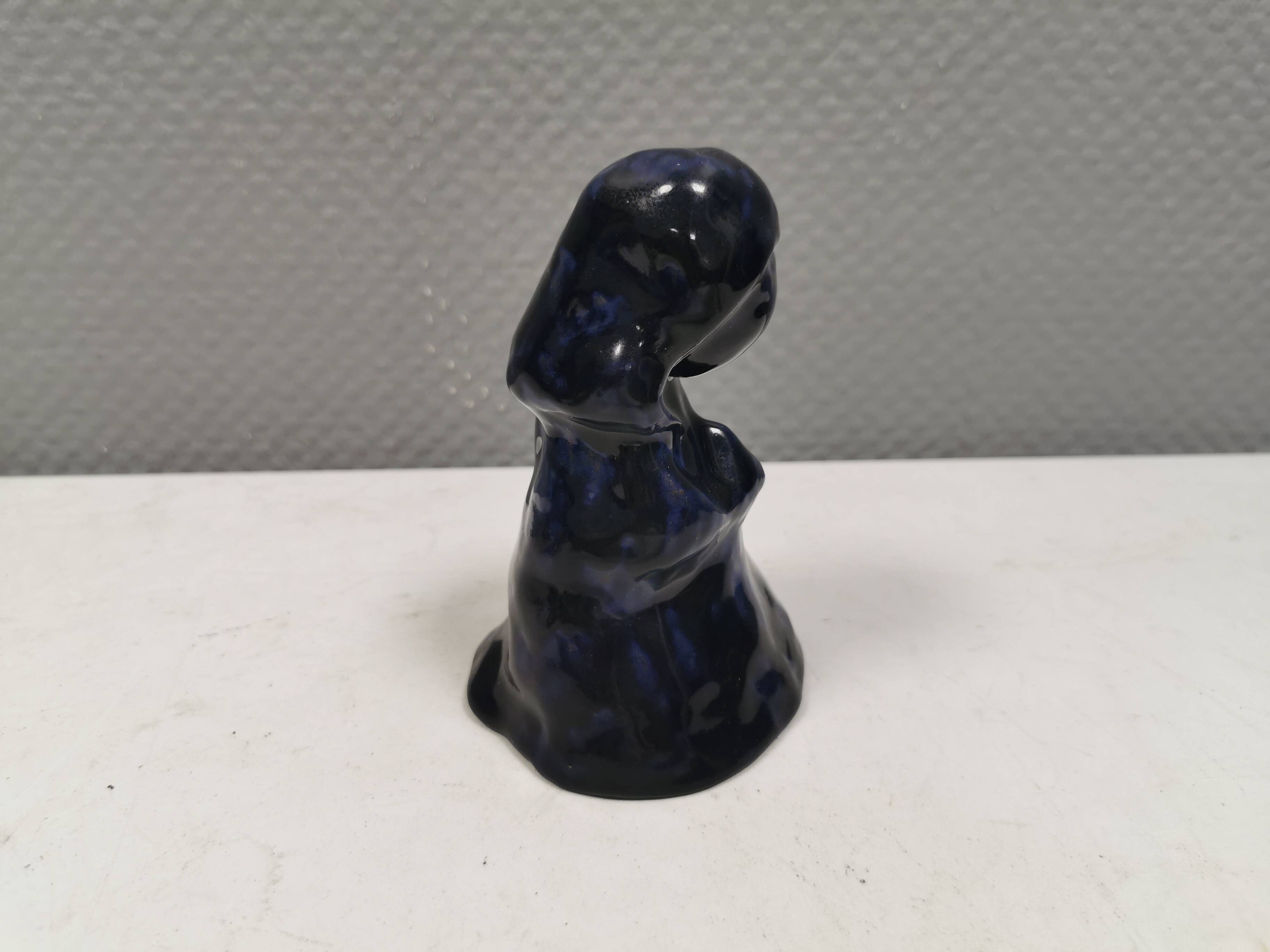 Lady figure in earthenware with shiny blue glaze