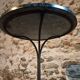 Old French bistro table with a marble top and a cast iron base.