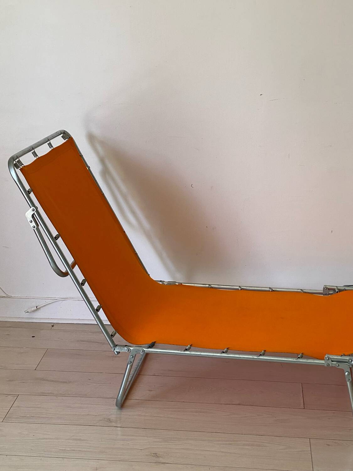 Orange and metal deckchair 1970