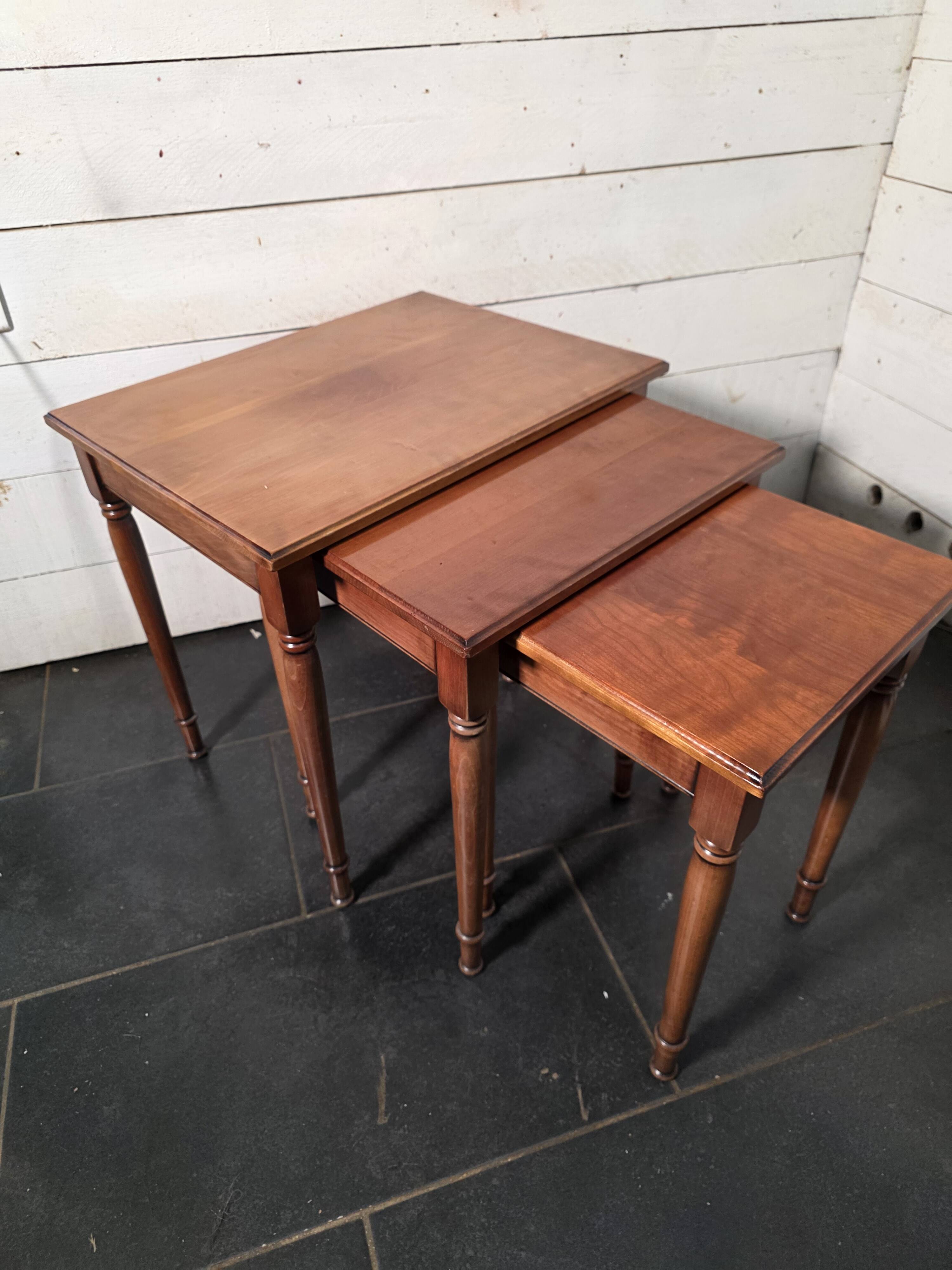 Nest of tables in solid cherry wood from the mid-20th century.