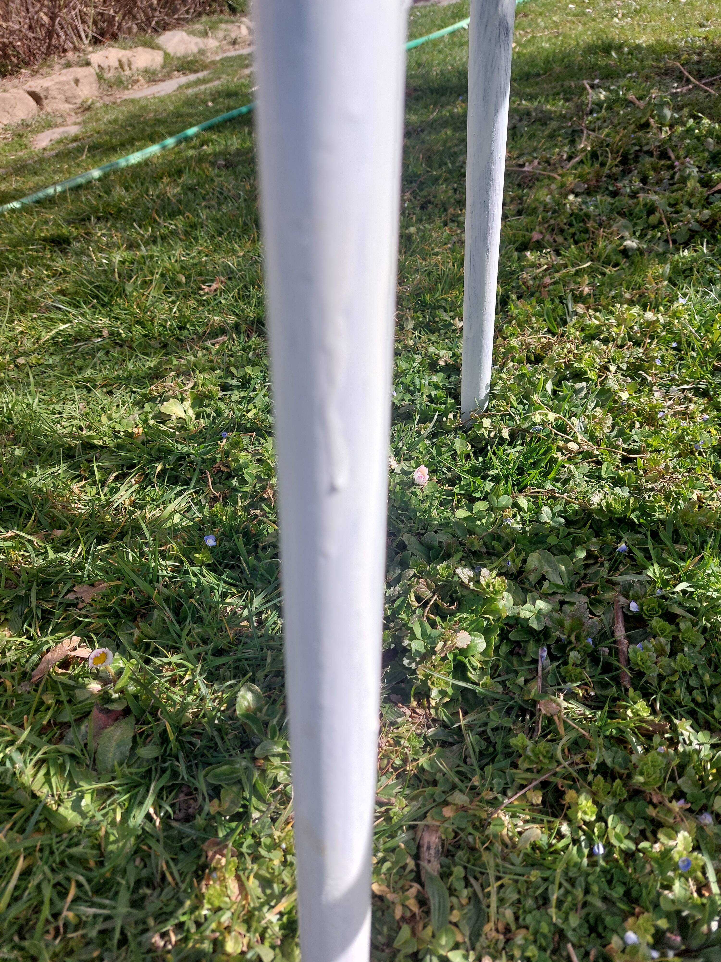 pair of white metal chairs, Tolix style