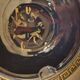 Small vintage ashtray in black ceramic with gold decoration in Greek style.