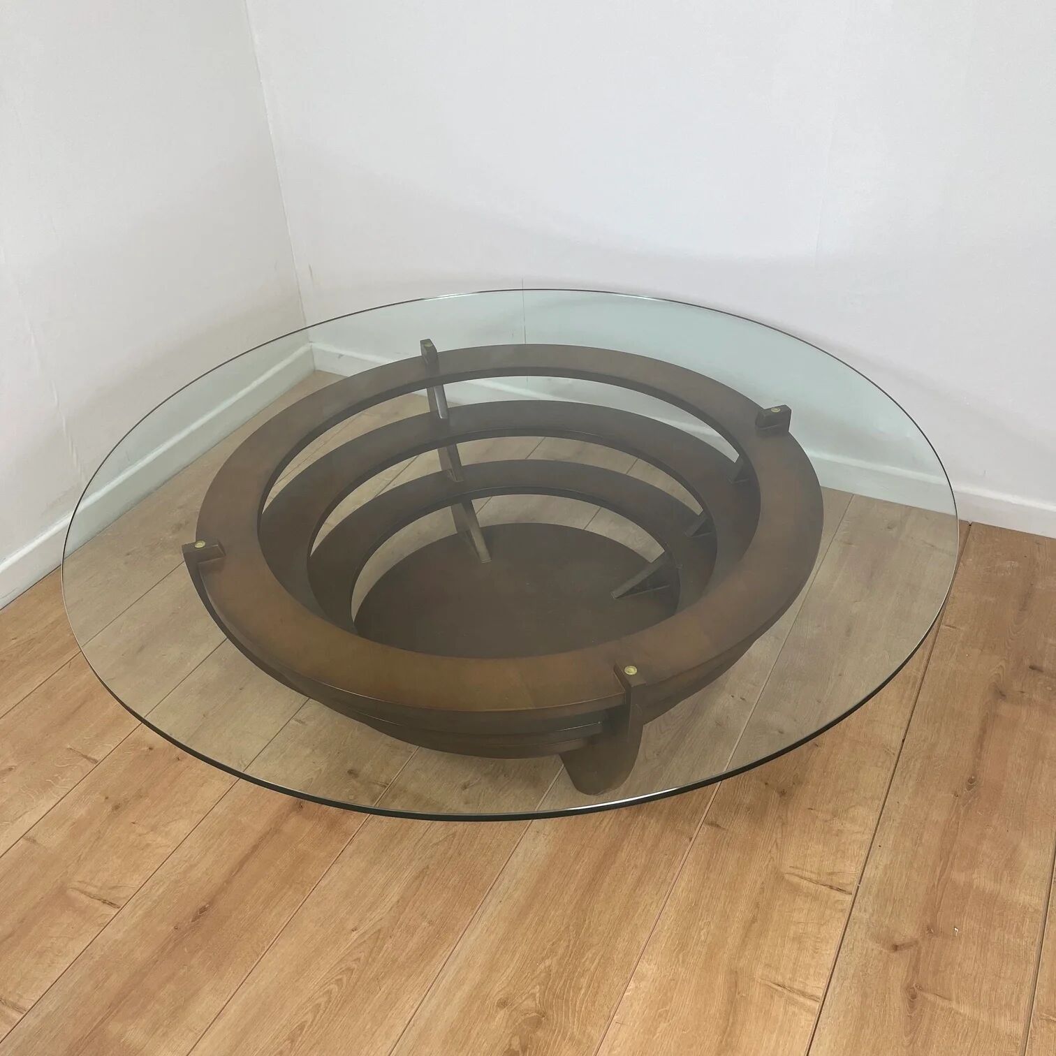 Sculptural coffee table with concentric rings, glass and wood, circa 1985.