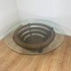 Sculptural coffee table with concentric rings, glass and wood, circa 1985.