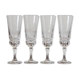 4 champagne flutes in vintage glass