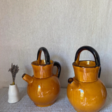 Enameled jugs signed Gomares