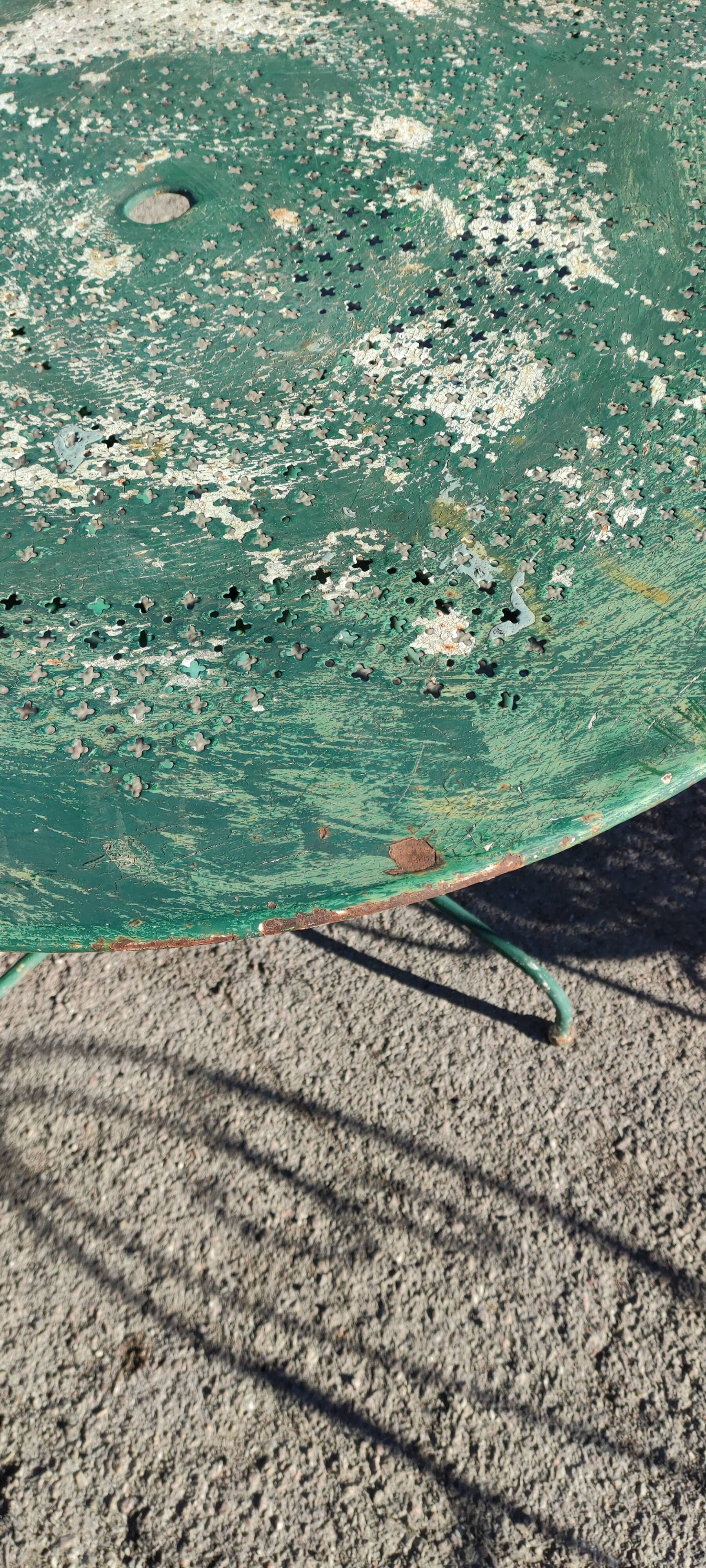 Garden table, two armchairs and a metal chair