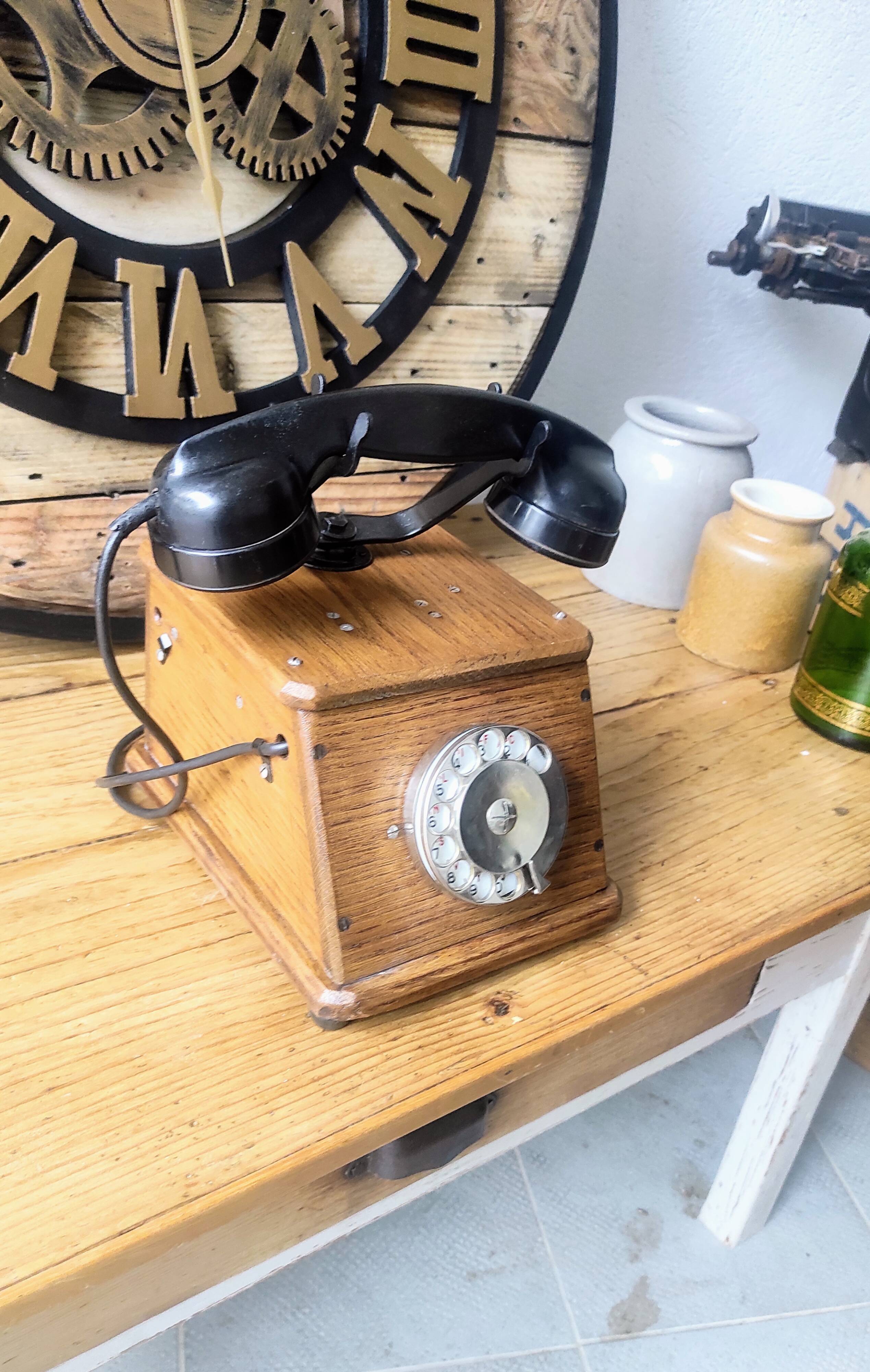 Old wooden dial crank telephone