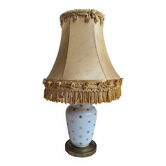Small vintage lamp in white porcelain with a star pattern and fringed shade.