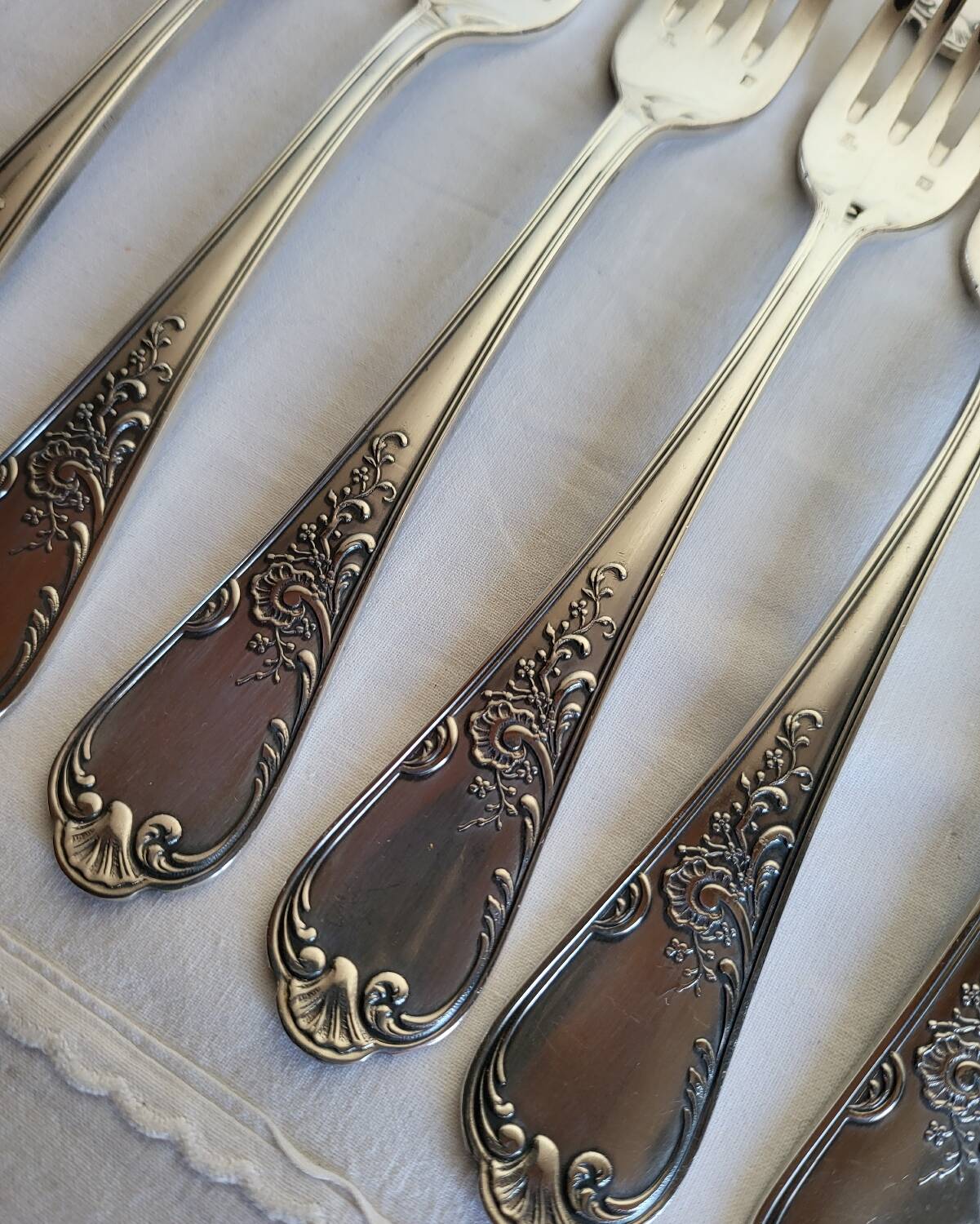 12 large silver-plated metal table forks by Guildart