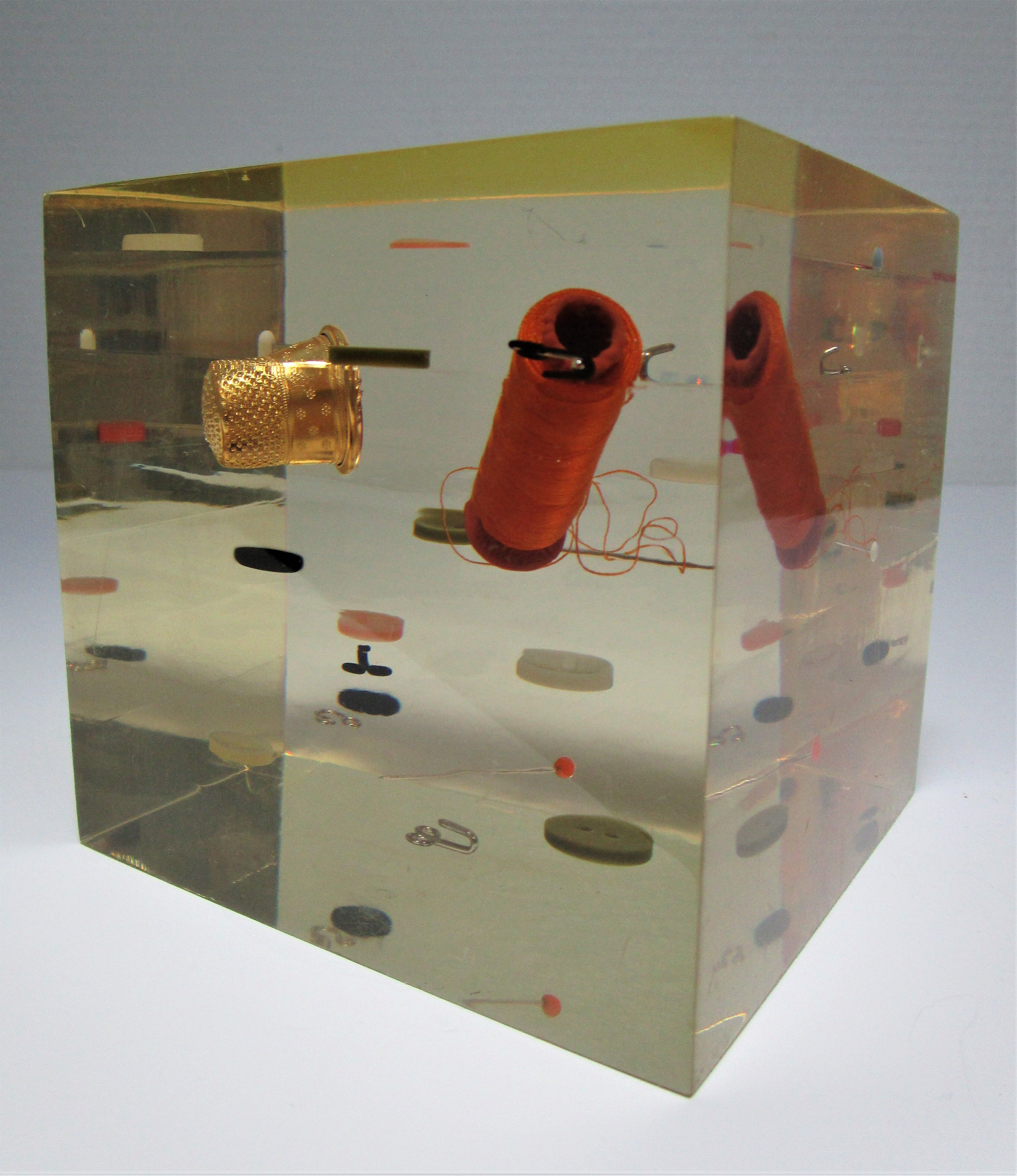 Paperweight sculpture block resin inclusions sewing design 70s