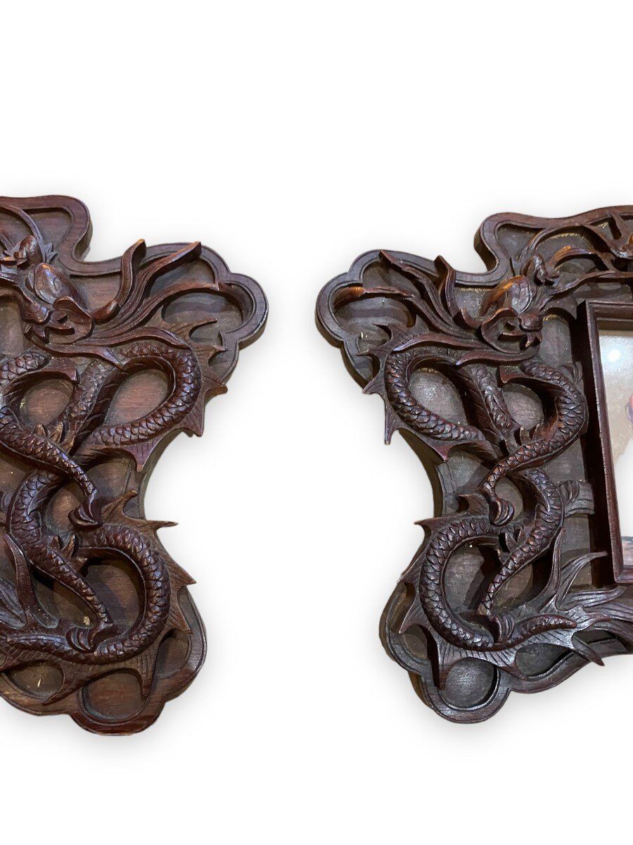Pair of exotic wooden frames with dragons