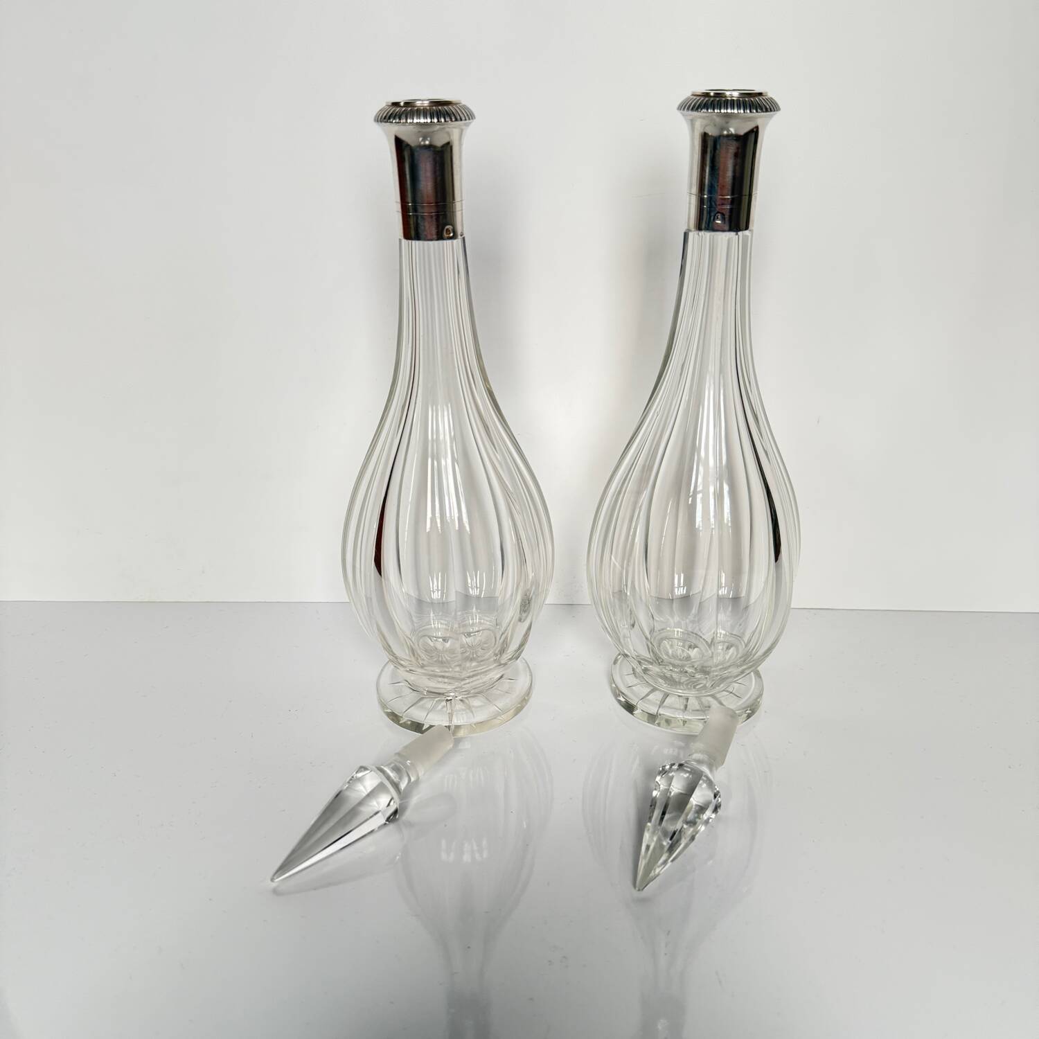 Pair of crystal decanters with solid silver mounts