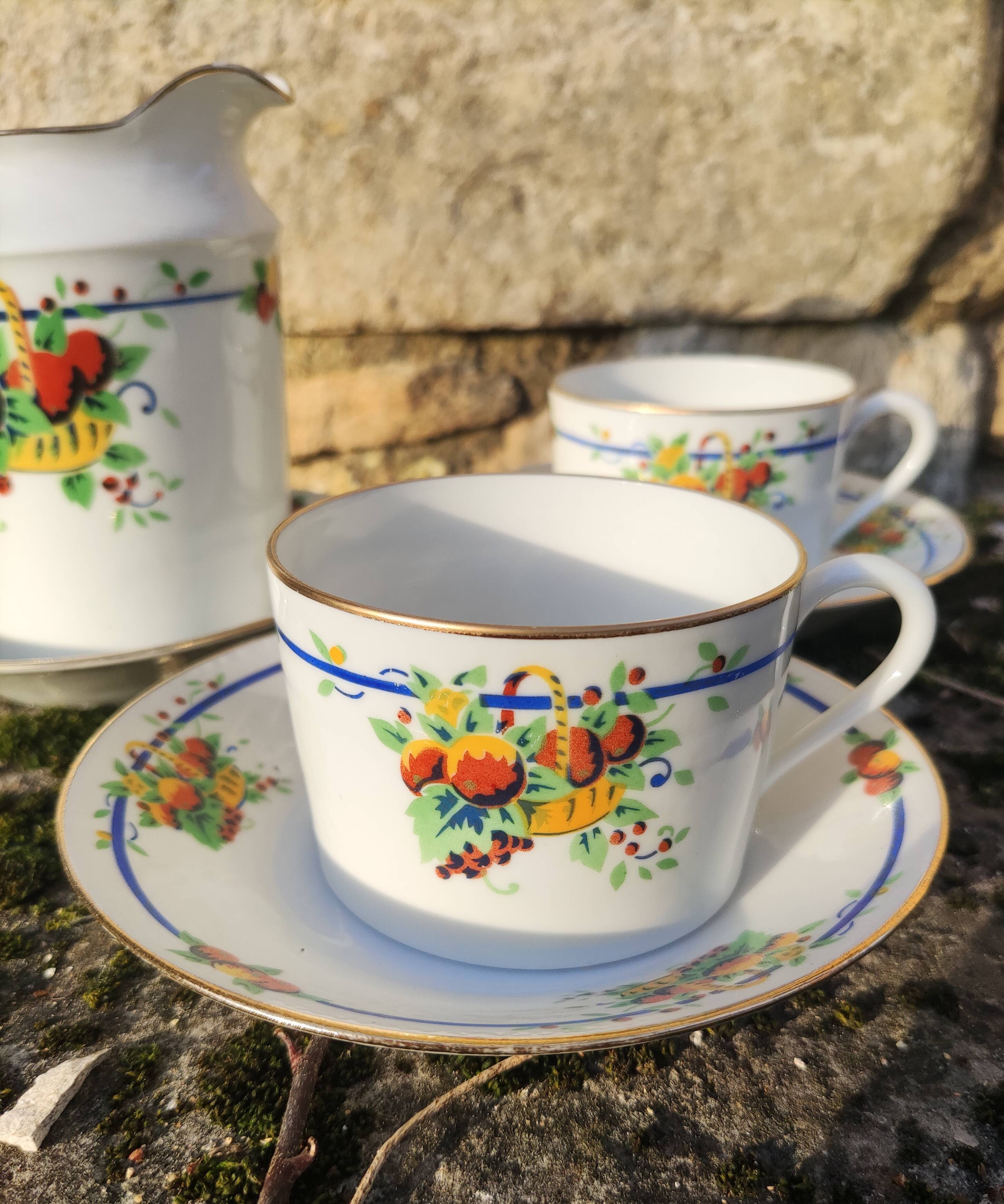 10 tea cups and creamer in Limoges porcelain