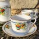 10 tea cups and creamer in Limoges porcelain