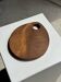 Small circular teak monoxyle cutting board with handle 22 x 13.