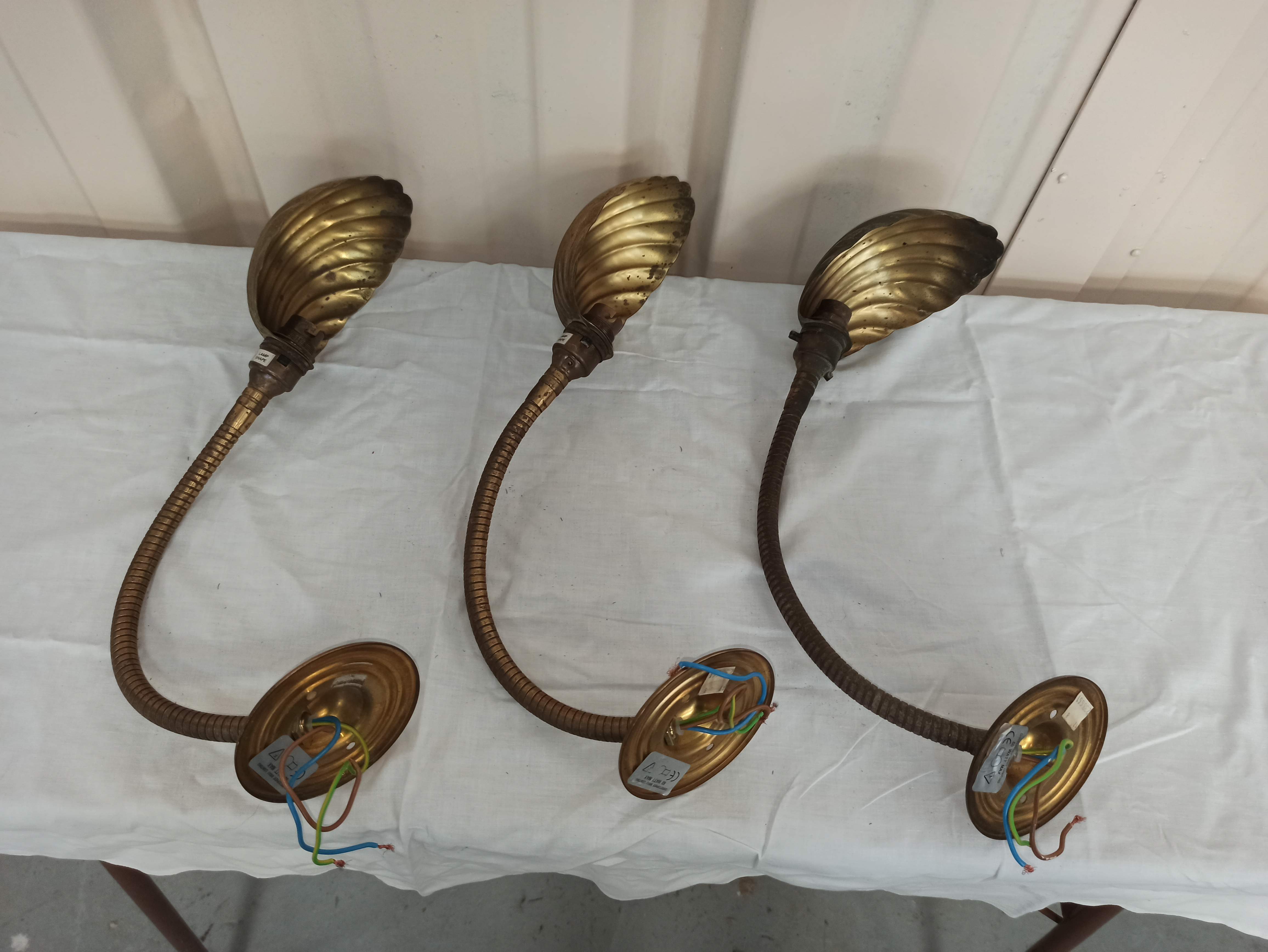 Trio of wall lamps Christopher Wray applies articulated lamp shell