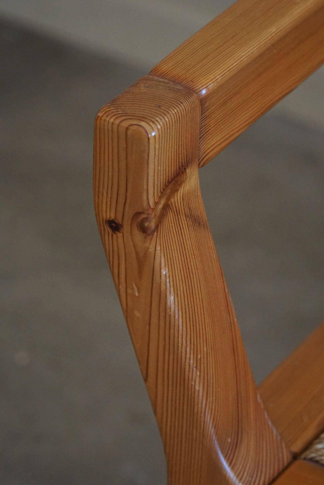 Tage Poulsen, a pair of brutalist chairs in pine and cord, Danish modern style, 1970s.