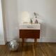 Wooden bedside table and nude