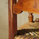 old armchair with leather armrests, from the 19th century