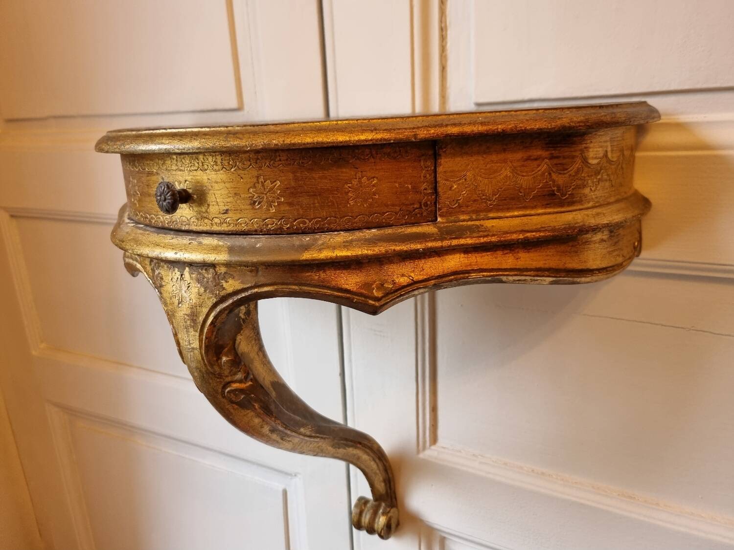 Mid-19th century wall console in wood and gilded stucco