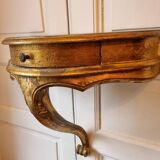 Mid-19th century wall console in wood and gilded stucco