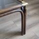 Bamboo coffee table with brass corners and smoked glass