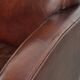 Dark cognac-coloured set of 2 sheepskin armchairs with a sleek design
