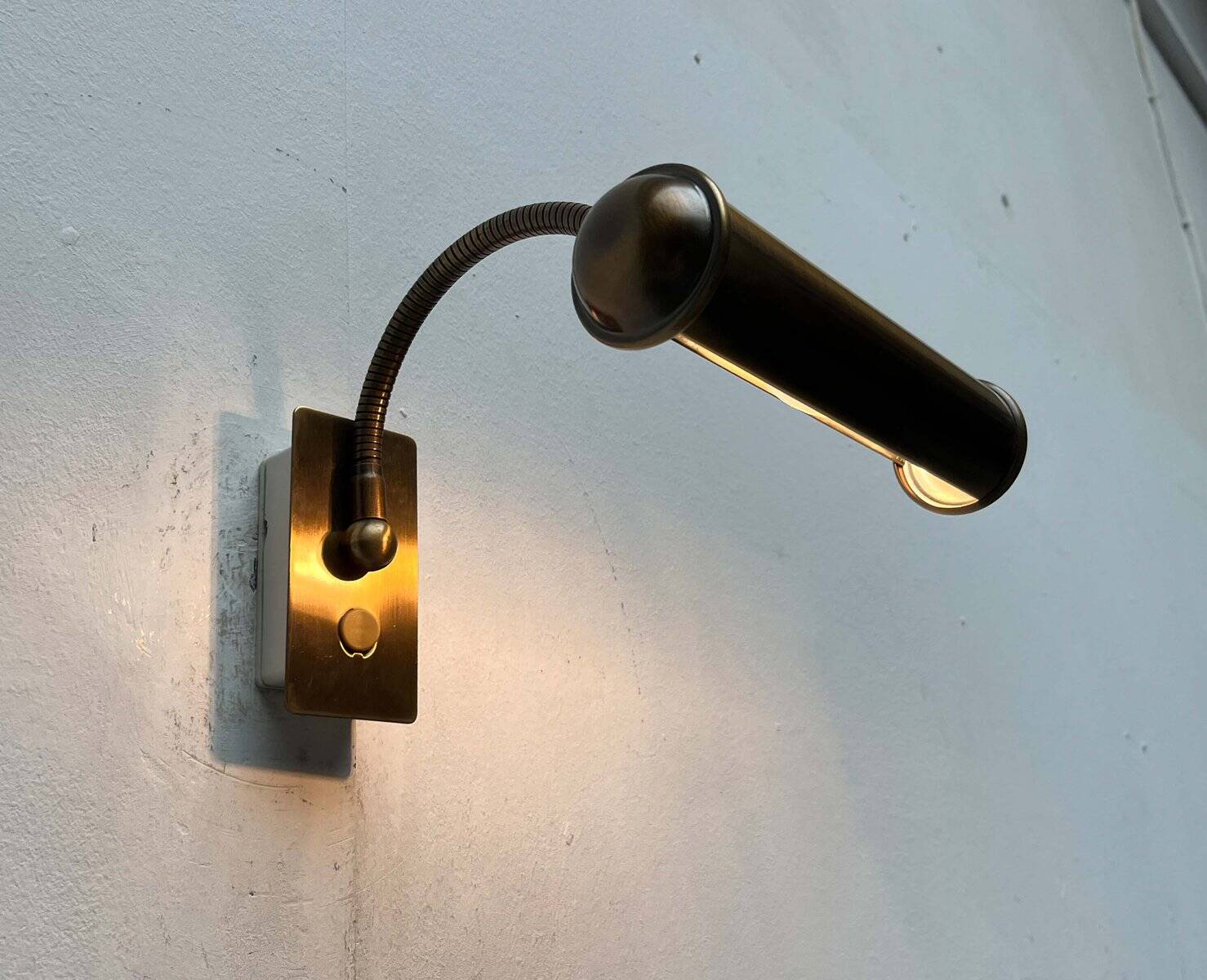 Vintage German brass patinated wall lamp with a gooseneck design by Honsel, 1970s.