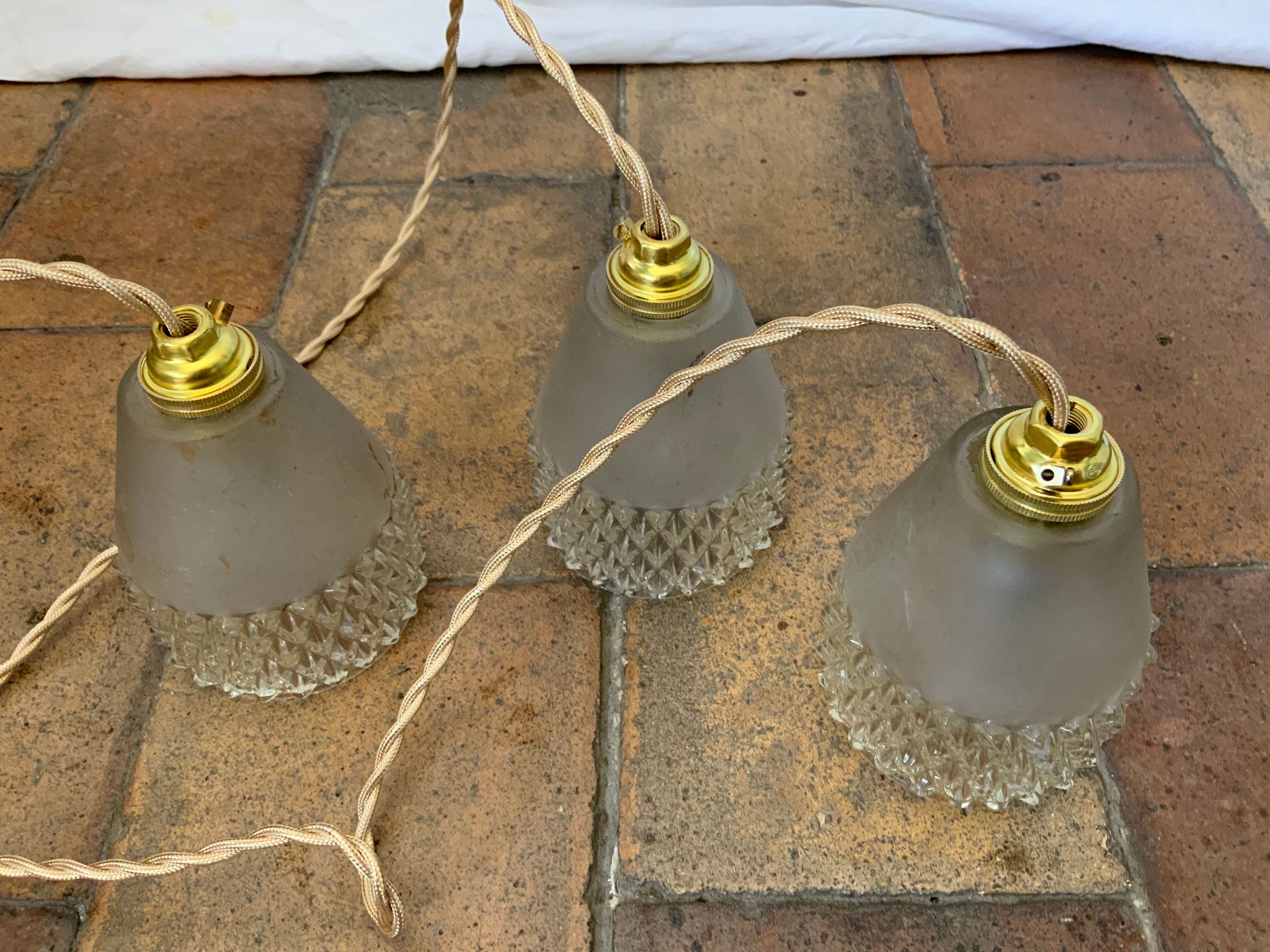 Trio of vintage suspensions