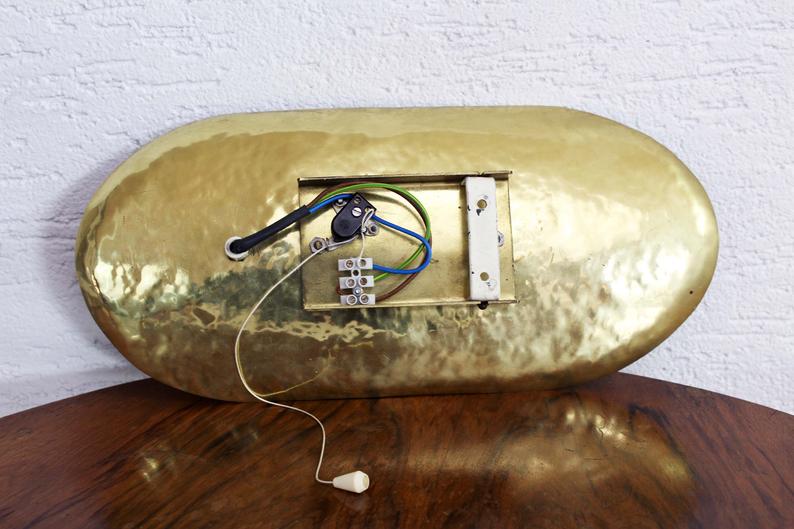 Hammered brass and perforated metal sconce