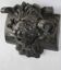 Carved lion head sculpture in stained wood